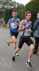 Nick Swinburn (Morpeth Harriers) battle for the lead with Tom Carson (Bolton Harriers) in the Northern Mens 6 Stage Road Relay.